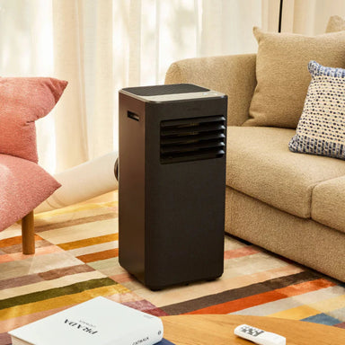 Ausclimate Smart Compact Portable Air Conditioner black model in a lounge room
