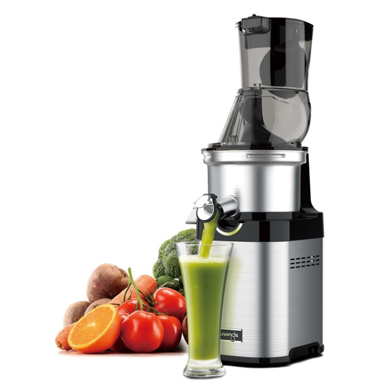 Kuvings CS700 Commercial Juicer with fruits and veggies on the side and a glass of smoothie