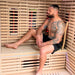 A man inside the Innerlight 3 Person Full Spectrum Infrared Sauna