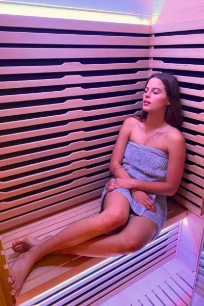 lady enjoying using the Innerlight 2 person full spectrum infrared sauna 