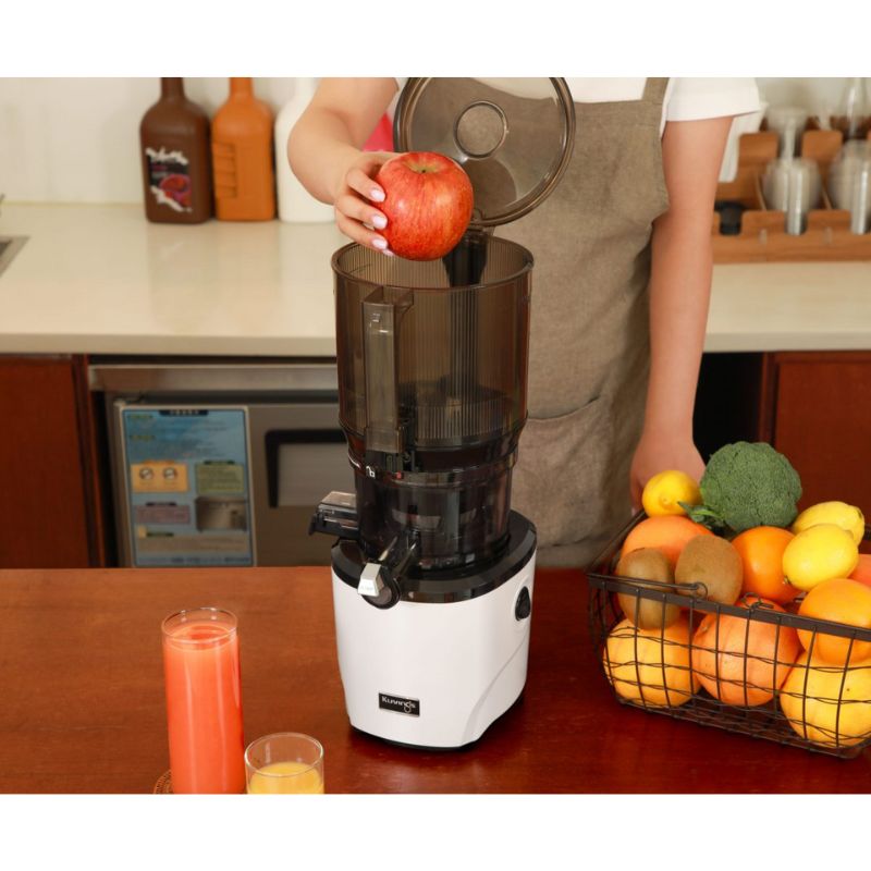 Feeding a large whole apple into the kuvings auto10 juicer