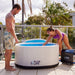 a couple setting up the PlusLife Commercial Portable Ice Bath