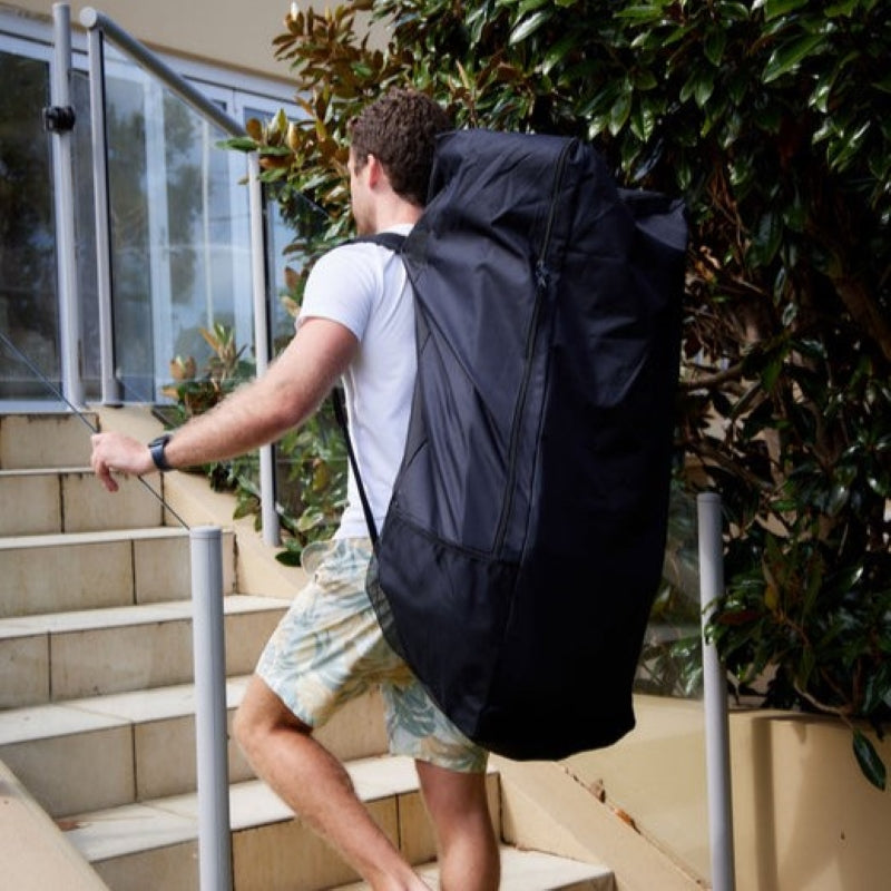 a man carrying the PlusLife Commercial Portable Ice Bath in his bag