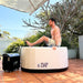 a man about to bathe in the PlusLife Commercial Portable Ice Bath