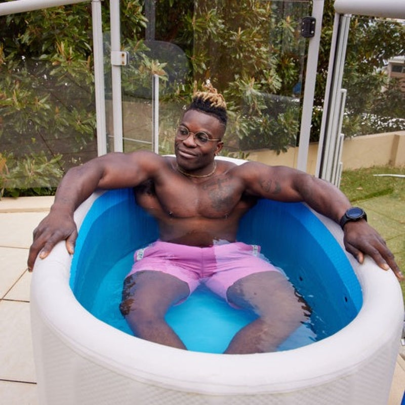 a man bathing in the PlusLife Commercial Portable Ice Bath