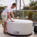 A man covering the PlusLife Commercial Portable Ice Bath