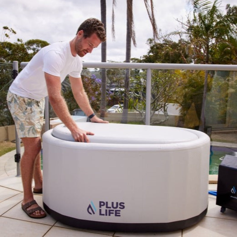 A man covering the PlusLife Commercial Portable Ice Bath