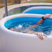 a man submerged in the PlusLife Commercial Portable Ice Bath