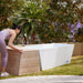 PlusLife Commercial Ice Bath outdoor with a woman arranging the chiller cover