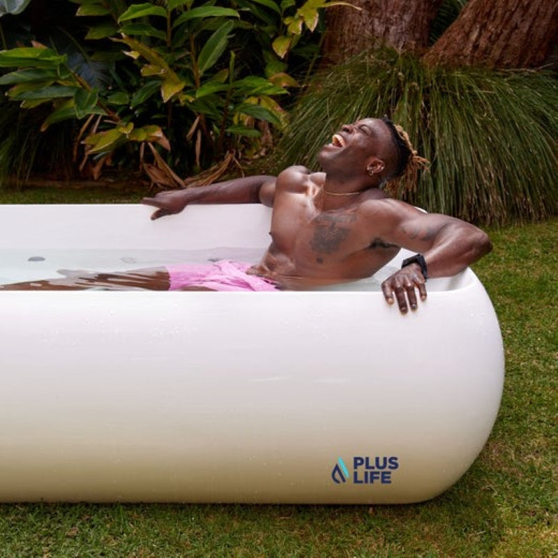 a man bathing in the PlusLife Commercial XL Ice Bath