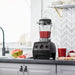 Vitamix Explorian Series E310 with smoothie inside and in the kitchen