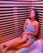 lady enjoying using the Innerlight 2 person full spectrum infrared sauna 