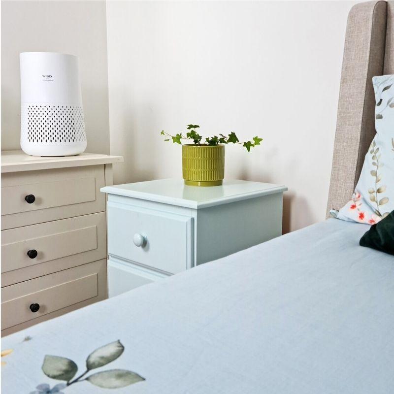 view of Winix Compact 4 Stage Air Purifier in a bedroom
